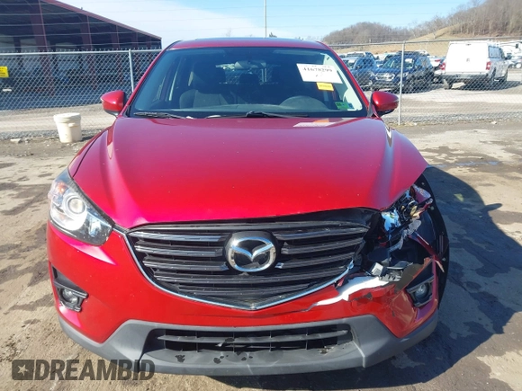 2016 Mazda CX-5 Touring with VIN JM3KE4CY4G0860035, listed as a IAAI auction lot 41678299 with 72,101 mi miles. Bid and sale history available at carsss.com. Image 12.