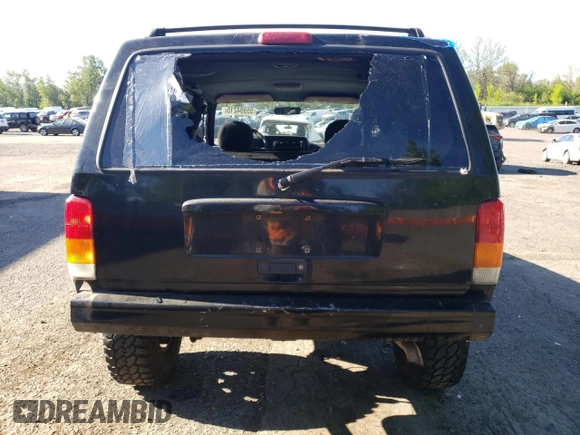 2000 Jeep Cherokee z VIN 1J4FF48S3YL180200, wystawiony jako Copart lot #55994215 z przebiegiem 209 182 mil mil oraz Szkoda całkowita • Salvage title. Historia ofert i sprzedaży dostępna na DreamBid. Obrazek 6.