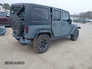 2015 Jeep Wrangler Unlimited Rubicon Hard Rock z VIN 1C4HJWFG1FL679873, wystawiony jako IAAI lot #41508722 z przebiegiem 97 165 mil mil oraz . Historia ofert i sprzedaży dostępna na DreamBid. Obrazek 4.