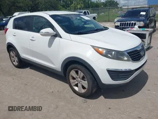 2012 Kia Sportage LX z VIN KNDPB3A2XC7237360, wystawiony jako IAAI lot #42478625 z przebiegiem 122 824 mil mil oraz . Historia ofert i sprzedaży dostępna na DreamBid. Obrazek 1.