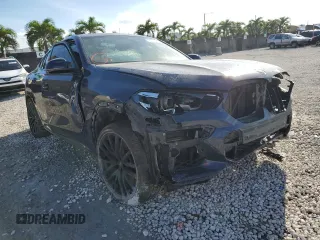 2021 BMW X6 M50i with VIN 5UXCY8C09M9E66884, listed as a Copart auction lot 63025622 with 26,220 mi miles and Salvage Title. Bid and sale history available at carsss.com. Image 1.