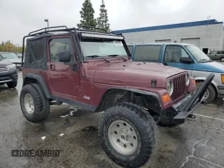 2001 Jeep Wrangler SE with VIN 1J4FA29P61P303287, listed as a Copart auction lot 48583385 with 162,447 mi miles and Salvage Title. Bid and sale history available at carsss.com. Image 4.