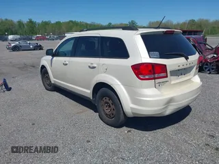 2014 Dodge Journey SE with VIN 3C4PDCAB9ET121415, listed as a IAAI auction lot 42138601 with 157,043 mi miles. Bid and sale history available at carsss.com. Image 3.