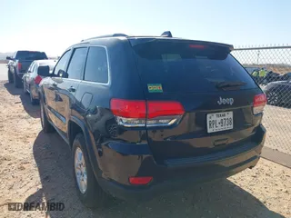 2014 Jeep Grand Cherokee Laredo with VIN 1C4RJEAG1EC348070, listed as a IAAI auction lot 41950898 with 129,883 mi miles. Bid and sale history available at carsss.com. Image 14.