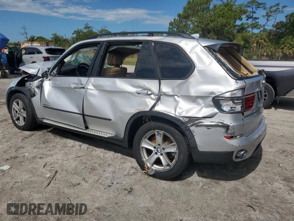 2012 BMW X5 35d with VIN 5UXZW0C51CL668064, listed as a Copart auction lot 62217845 with 140,544 mi miles and Salvage title. Bid and sale history available at DreamBid. Image 2.