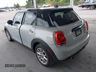 2019 MINI Hardtop 4 Door Cooper z VIN WMWXU1C59K2J02305, wystawiony jako IAAI lot #42205461 z przebiegiem 75 101 mil mil oraz . Historia ofert i sprzedaży dostępna na DreamBid. Obrazek 3.