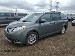 2014 Toyota Sienna XLE with VIN 5TDYK3DCXES477087, listed as a Copart auction lot 59424515 with 116,554 mi miles and Salvage title. Bid and sale history available at DreamBid. Image 1.