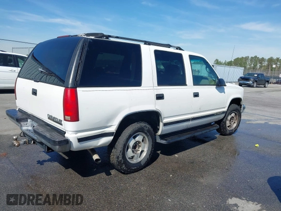 1999 Chevrolet Tahoe Z71 with VIN 1GNEK13R3XJ412067, listed as a IAAI auction lot 41789660 with 196,916 mi miles and . Bid and sale history available at DreamBid. Image 4.