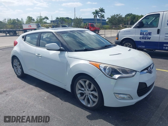 2013 Hyundai Veloster w/Gray Int with VIN KMHTC6AD0DU150516, listed as a IAAI auction lot 42164880 with 122,841 mi miles and . Bid and sale history available at DreamBid. Image 1.