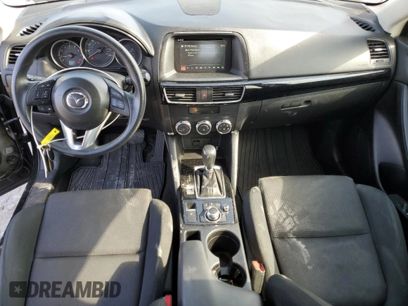 2016 Mazda CX-5 Sport with VIN JM3KE4BY6G0749973, listed as a Copart auction lot 54131635 with 97,480 mi miles and Salvage title. Bid and sale history available at DreamBid. Image 8.