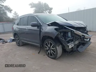 2022 Honda Pilot Touring 7-Passenger with VIN 5FNYF5H69NB000546, listed as a IAAI auction lot 40695065 with 43,592 mi miles and . Bid and sale history available at DreamBid. Image 1.