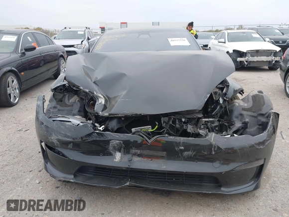 2022 Tesla Model S Plaid with VIN 5YJSA1E65NF484149, listed as a IAAI auction lot 40937538 with 11,459 mi miles and . Bid and sale history available at DreamBid. Image 11.