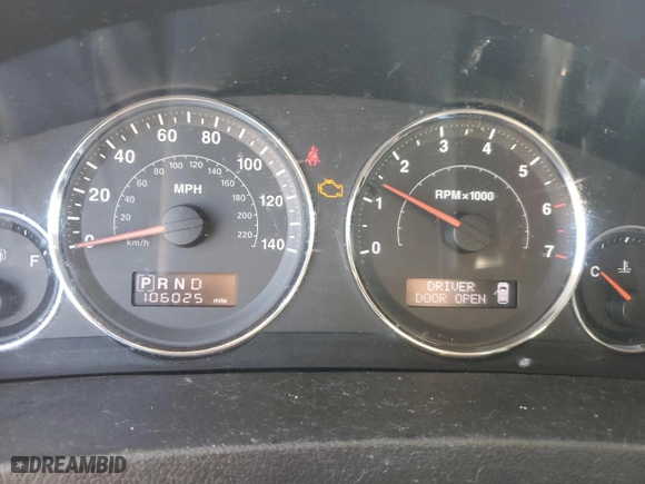 2010 Jeep Grand Cherokee Laredo with VIN 1J4RR4GT1AC106990, listed as a Copart auction lot 87421664 with 106,025 mi miles and Salvage Title. Bid and sale history available at carsss.com. Image 9.