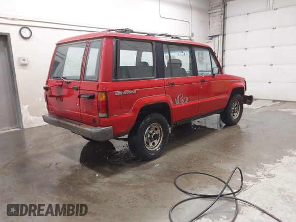 1991 Isuzu Trooper z VIN JACCH58R6M8905869, wystawiony jako IAAI lot #42394651 z przebiegiem 117 130 mil mil oraz . Historia ofert i sprzedaży dostępna na DreamBid. Obrazek 4.