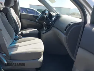 2012 Kia Sedona LX with VIN KNDMG4C70C6491703, listed as a IAAI auction lot 42128411 with 246,586 mi miles. Bid and sale history available at carsss.com. Image 5.