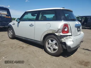 2011 MINI Hardtop with VIN WMWSU3C5XBTX96048, listed as a Copart auction lot 57607955 with 99,632 mi miles and Salvage title. Bid and sale history available at DreamBid. Image 2.
