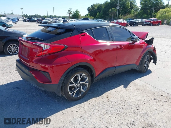 2020 Toyota C-HR LE with VIN JTNKHMBX3L1066720, listed as a IAAI auction lot 42042139 with 98,925 mi miles and . Bid and sale history available at DreamBid. Image 4.