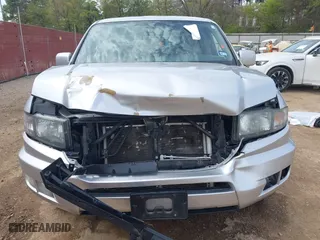 2014 Honda Ridgeline SE with VIN 5FPYK1F62EB013329, listed as a IAAI auction lot 41876728 with 127,014 mi miles. Bid and sale history available at carsss.com. Image 12.