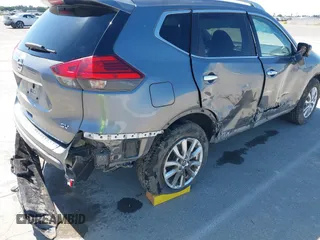 2017 Nissan Rogue SV with VIN KNMAT2MT9HP581822, listed as a IAAI auction lot 42140794 with 74,261 mi miles. Bid and sale history available at carsss.com. Image 6.