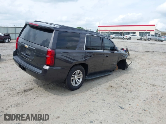 2018 Chevrolet Tahoe LT with VIN 1GNSKBKCXJR103730, listed as a IAAI auction lot 42125208 with 212,360 mi miles and . Bid and sale history available at DreamBid. Image 4.