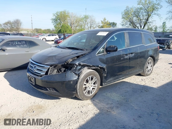 2012 Honda Odyssey EX-L with VIN 5FNRL5H6XCB016801, listed as a IAAI auction lot 42112141 with 164,671 mi miles and . Bid and sale history available at carsss.com. Image 2.