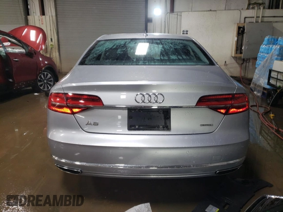 2015 Audi A8 with VIN WAUJGAFD1FN011100, listed as a Copart auction lot 49166055 with 38,575 mi miles and Salvage title. Bid and sale history available at DreamBid. Image 6.
