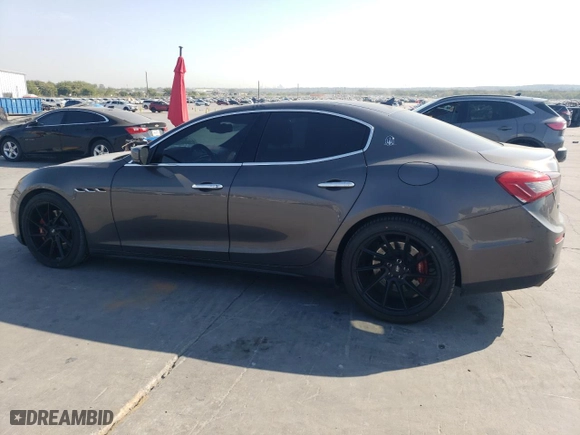 2014 Maserati Ghibli S Q4 with VIN ZAM57RTA7E1085782, listed as a Copart auction lot 75537634 with 111,616 mi miles and Salvage Title. Bid and sale history available at carsss.com. Image 2.
