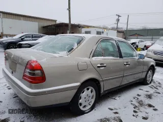 1994 Mercedes-Benz C with VIN WDBHA28E6RF015428, listed as a Copart auction lot 85866784 with Not Provided miles and Salvage Title. Bid and sale history available at carsss.com. Image 3.