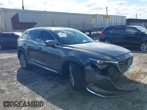 2019 Mazda CX-9 Signature with VIN JM3TCBEYXK0324257, listed as a IAAI auction lot 41986590 with Not provided miles and . Bid and sale history available at DreamBid. Image 1.