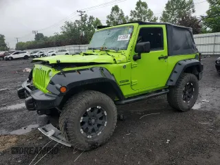 2012 Jeep Wrangler Sport with VIN 1C4AJWAG2CL233722, listed as a Copart auction lot 61125095 with 49,864 mi miles and Salvage title. Bid and sale history available at DreamBid. Image 1.