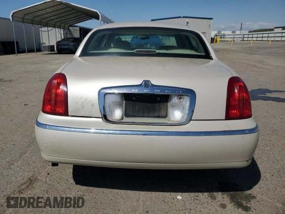 2002 Lincoln Town Car Cartier z VIN 1LNHM83W72Y617952, wystawiony jako Copart lot #50666275 z przebiegiem 238 169 mil mil oraz Czysty tytuł • Clean title. Historia ofert i sprzedaży dostępna na DreamBid. Obrazek 6.