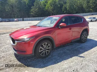 2018 Mazda CX-5 Touring z VIN JM3KFACM3J0313063, wystawiony jako Copart lot #58129665 z przebiegiem Nie podano mil oraz Szkoda całkowita • Salvage title. Historia ofert i sprzedaży dostępna na DreamBid. Obrazek 1.