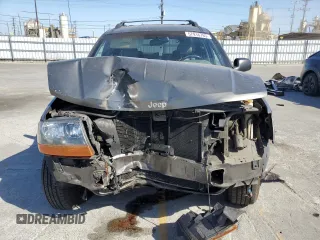 2000 Jeep Grand Cherokee Laredo with VIN 1J4G248S2YC377133, listed as a Copart auction lot 57916785 with 217,525 mi miles and Salvage title. Bid and sale history available at DreamBid. Image 5.