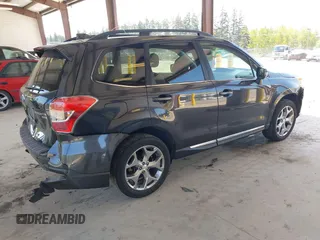 2016 Subaru Forester Touring with VIN JF2SJAXC0GH564305, listed as a IAAI auction lot 42111356 with 75,529 mi miles and . Bid and sale history available at DreamBid. Image 4.