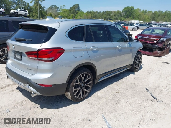 2021 BMW X1 sDrive28i with VIN WBXJG7C06M5T14235, listed as a IAAI auction lot 42021762 with 53,384 mi miles and . Bid and sale history available at DreamBid. Image 4.