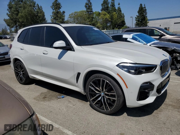 2019 BMW X5 xDrive40i with VIN 5UXCR6C57KLK85504, listed as a Copart auction lot 60908665 with 21,333 mi miles and Salvage title. Bid and sale history available at DreamBid. Image 4.