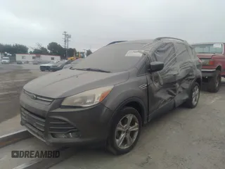 2014 Ford Escape SE with VIN 1FMCU0GXXEUA77765, listed as a IAAI auction lot 40158558 with 88,373 mi miles. Bid and sale history available at carsss.com. Image 2.