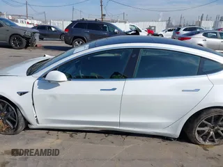 2019 Tesla Model 3 Long Range with VIN 5YJ3E1EB1KF510912, listed as a IAAI auction lot 41857775 with Not Provided miles and . Bid and sale history available at DreamBid. Image 14.