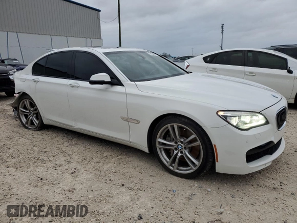 2013 BMW 7 Series 750i with VIN WBAYA8C54DC996569, listed as a Copart auction lot 74199774 with 107,871 mi miles and Salvage Title. Bid and sale history available at DreamBid. Image 4.