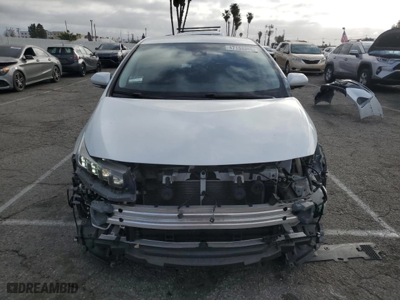 2022 Toyota Prius Prime LE with VIN JTDKAMFP7N3199717, listed as a Copart auction lot 47133385 with 54,977 mi miles and Salvage Title. Bid and sale history available at carsss.com. Image 5.