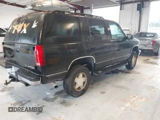 1996 GMC Yukon with VIN 1GKEK13R2TJ743987, listed as a IAAI auction lot 41652826 with 325,292 mi miles. Bid and sale history available at carsss.com. Image 4.
