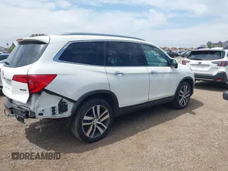2017 Honda Pilot Touring with VIN 5FNYF5H95HB042632, listed as a IAAI auction lot 42011885 with 103,321 mi miles. Bid and sale history available at carsss.com. Image 4.