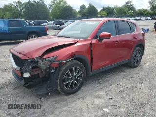 2018 Mazda CX-5 Grand Touring z VIN JM3KFADM7J0313596, wystawiony jako Copart lot #57517155 z przebiegiem 216 812 mil mil oraz Szkoda całkowita • Salvage title. Historia ofert i sprzedaży dostępna na DreamBid. Obrazek 1.