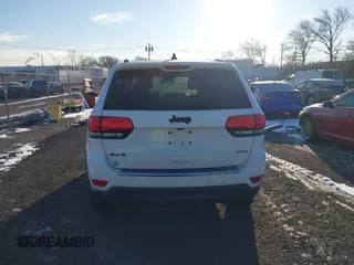 2014 Jeep Grand Cherokee Limited with VIN 1C4RJFBG7EC220677, listed as a IAAI auction lot 41177354 with 148,445 mi miles and . Bid and sale history available at DreamBid. Image 16.