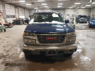 2011 GMC Canyon SLE1 with VIN 1GTH6MFE3B8123808, listed as a IAAI auction lot 41611231 with 142,877 mi miles. Bid and sale history available at carsss.com. Image 12.