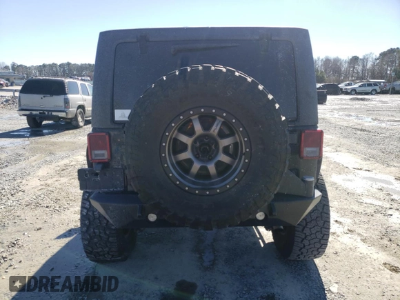 2016 Jeep Wrangler Unlimited Rubicon Hard Rock with VIN 1C4BJWFG9GL209484, listed as a Copart auction lot 87815475 with 85,729 mi miles and Salvage Title. Bid and sale history available at carsss.com. Image 6.