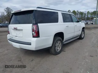 2015 GMC Yukon XL SLT with VIN 1GKS1HKC7FR126375, listed as a IAAI auction lot 41689017 with 218,622 mi miles. Bid and sale history available at carsss.com. Image 4.