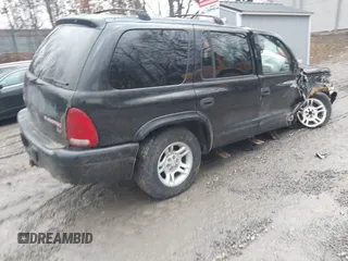 2003 Dodge Durango SLT z VIN 1D4HS48NX3F609539, wystawiony jako IAAI lot #41577445 z przebiegiem Nie podano mil oraz . Historia ofert i sprzedaży dostępna na DreamBid. Obrazek 4.