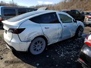 2023 Tesla Model Y Long Range z VIN 7SAYGDEE5PF785124, wystawiony jako Copart lot #56553785 z przebiegiem 31 341 mil mil oraz Szkoda całkowita • Salvage title. Historia ofert i sprzedaży dostępna na DreamBid. Obrazek 3.