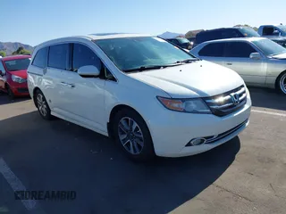 2014 Honda Odyssey Touring with VIN 5FNRL5H97EB037361, listed as a IAAI auction lot 42106742 with 198,279 mi miles and . Bid and sale history available at DreamBid. Image 1.